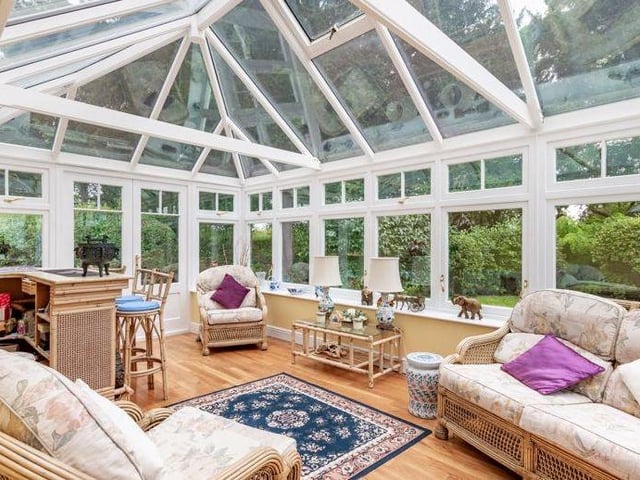 The property's garden room is far more than a conservatory. It is bright, airy and spacious, and offers stunning views.