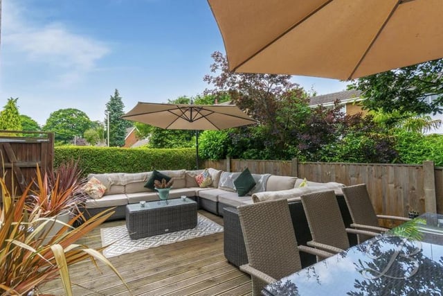 Moving outside now into the garden, and this spacious decked seating area is perfect for entertaining family and friends. A summer delight, no less.