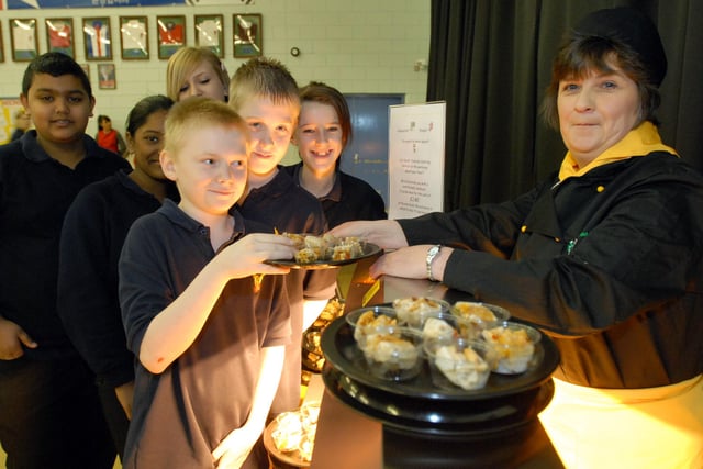 Chef Linda Seales was showing students the new menu in this 2009 photo. Is there someone you know in the photo?