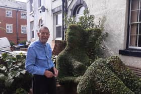 Keith Tyssen beside the elegantly sculpted hedge outside his home on Gell Street in Broomhall, Sheffield, which he has named Gloria after a street walker who used to frequent the area