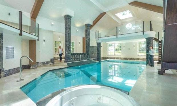 The property features a leisure suite on the ground floor, with a pool, steam room, sauna, spa, sitting area overlooking pool, double doors which lead out onto patio area, double showers and plant room