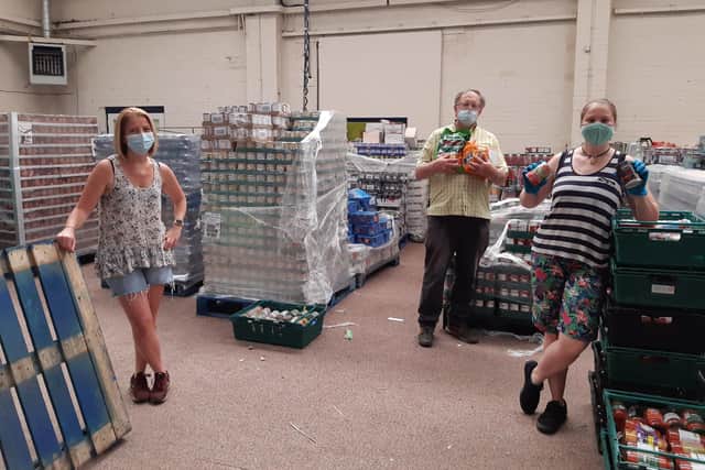 Left to right - Alison Wise, Harry Welburn and Becky Eden-Green volunteer at the foodbank.