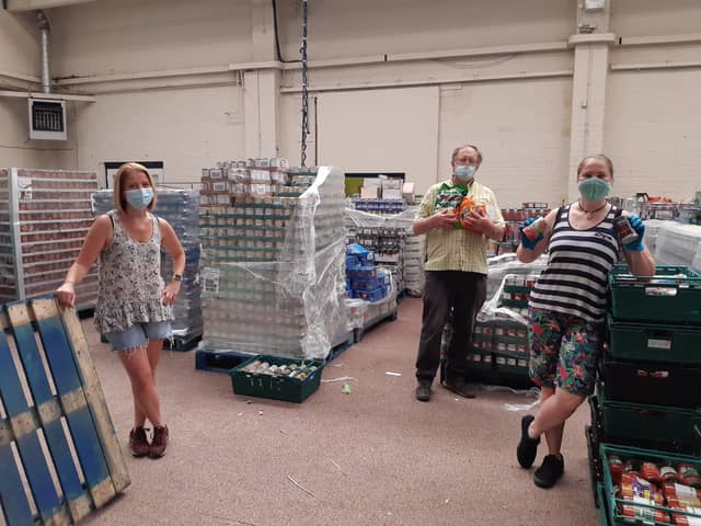Left to right - Alison Wise, Harry Welburn and Becky Eden-Green volunteer at the foodbank.