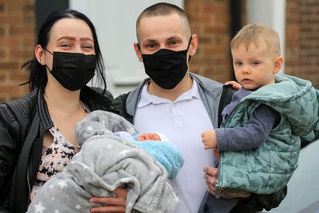 A baby was born in the back of a taxi last week. Dad Kamil Truss, mum Natalia Jodello, newborn Filip and one-year-old Kuba. Picture: Chris Etchells