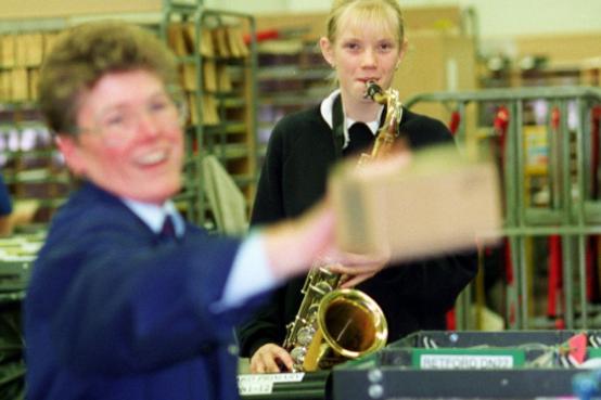 On the busiest day of the year the sorting office were kept entertained by pupils from Balby School in 1997