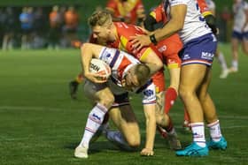 Eagles centre James Glover making a tackle against Wakefield