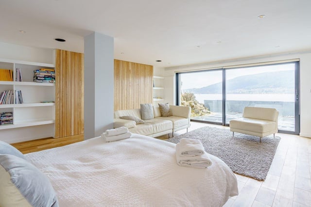 The master bedroom has a balcony in which to enjoy the coastal setting.