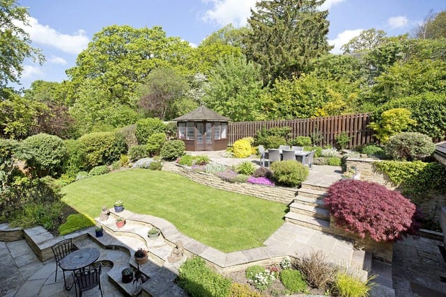 There are gardens to both the front and rear of the property, with the private back garden benefitting from landscaped laws, mature shrubs, hedges and a timber summerhouse.