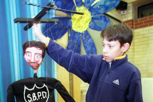 Young people from Langsett and The Manor with their puppets for their performance of The Tramp Story 13-year-old Alex Marlowe with the police boss in 2000