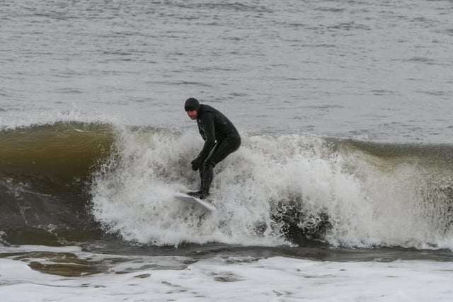 A surfer was spotted taking advantage of the mild December weather.