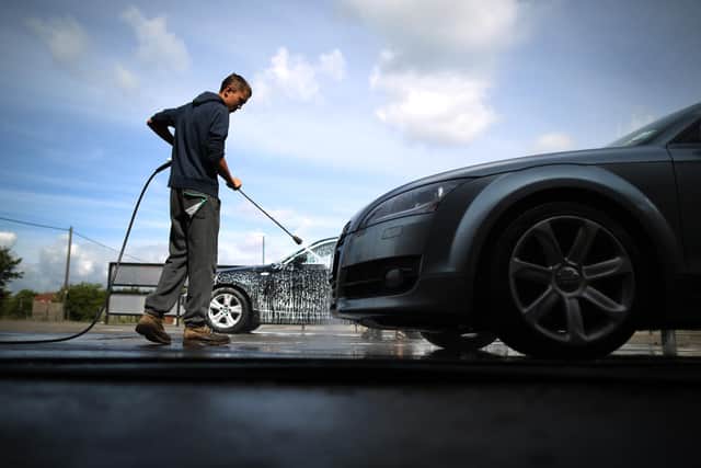 Man washes car  (Photo by Peter Macdiarmid/Getty Images)