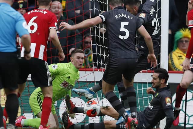 Dean Henderson of Sheffield United makes series of saves in a goal mouth scramble during the Premier League match at Bramall Lane, Sheffield: Simon Bellis/Sportimage