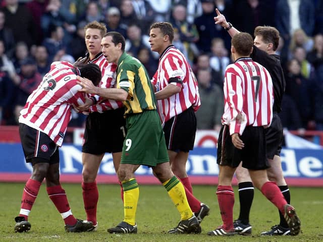 Sheffield United's Patrick Suffo (left) becomes the third player to be sent off by referee Eddie Wolstenholme in the 'Battle of Bramall Lane' - Paul Barker/PA Wire.