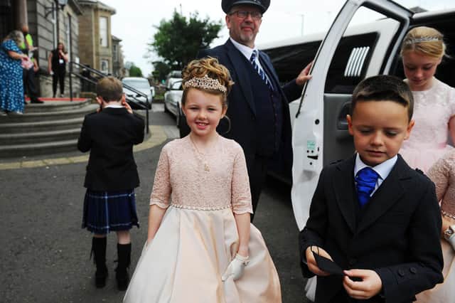 The royal retinue arrive in limos at Grangemouth Town Hall for the crowning ceremony