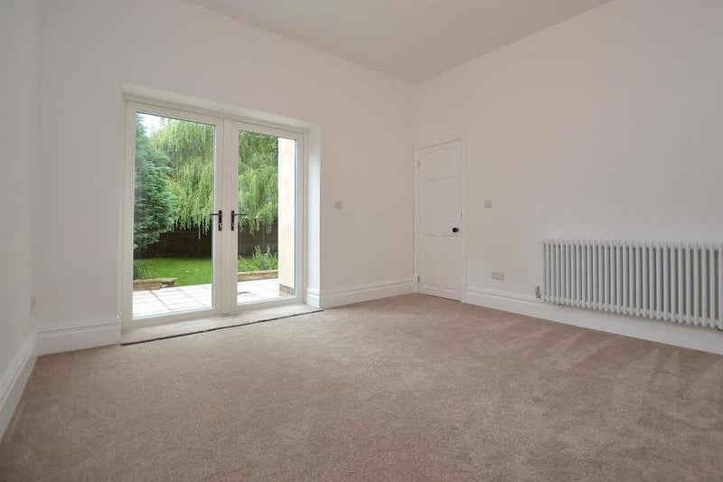 A second, versatile reception room, leading from the lounge. It has double-glazed French doors that open on to the garden at the back.