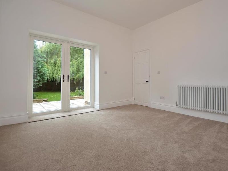 A second, versatile reception room, leading from the lounge. It has double-glazed French doors that open on to the garden at the back.