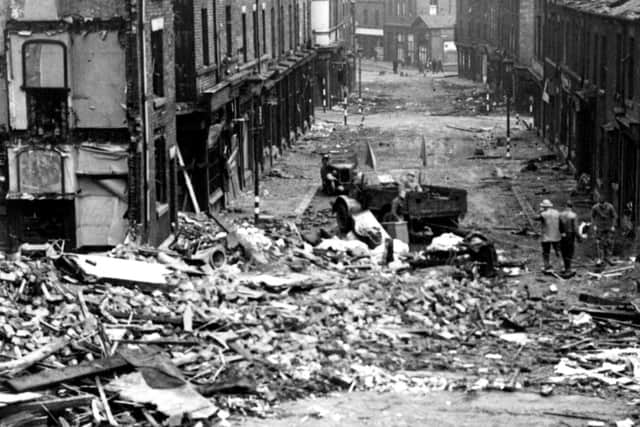 Unexploded bomb and bomb damage, adjacent to Rare and Racy on Devonshire Street, 12 Dec 1940. Pic: Picture Sheffield (Sheffield Local Studies Library): s01323