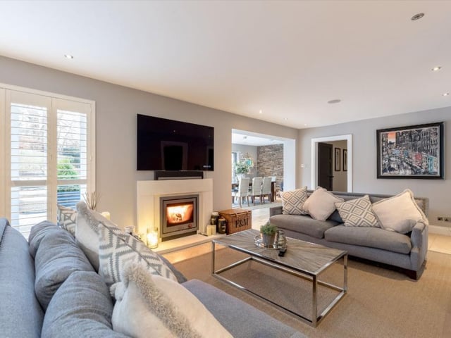 The living area features a multi-fuel stove.