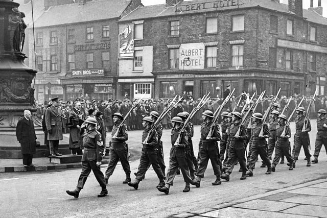 Soldiers march past the Cenotaph in Barker's Pool, Sheffield, December 1943