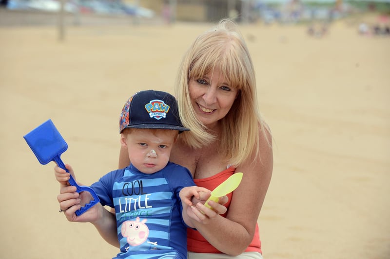 Maria Conley with grandson Coby Coates, enjoying the hot sunny weather at Sandhaven Beach.
