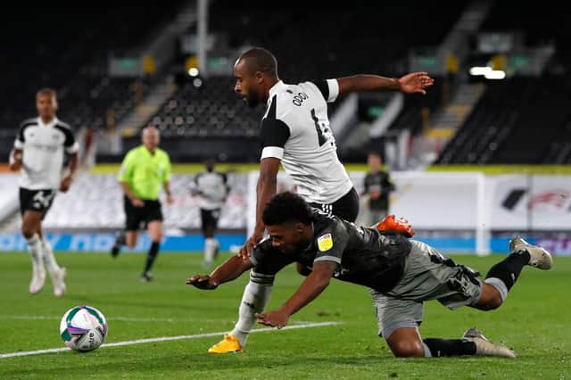 Elias Kachunga vies with Denis Odoi as Fulham faced Sheffield Wednesday at Craven Cottage. (Photo by PAUL CHILDS / POOL / AFP)