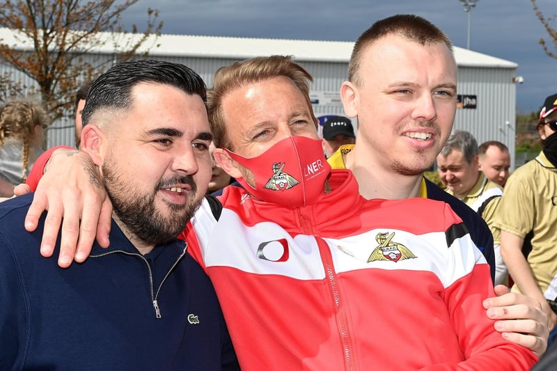 Supporters share a picture with the Rovers legend
