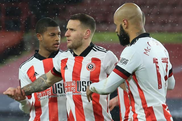 Sheffield United's Billy Sharp (C) celebrates with teammates after scoring the winner from the penalty spot against Bristol City (Photo by LINDSEY PARNABY/AFP via Getty Images)