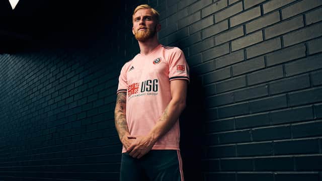 Sheffield United striker Oli McBurnie models the club's new away kit