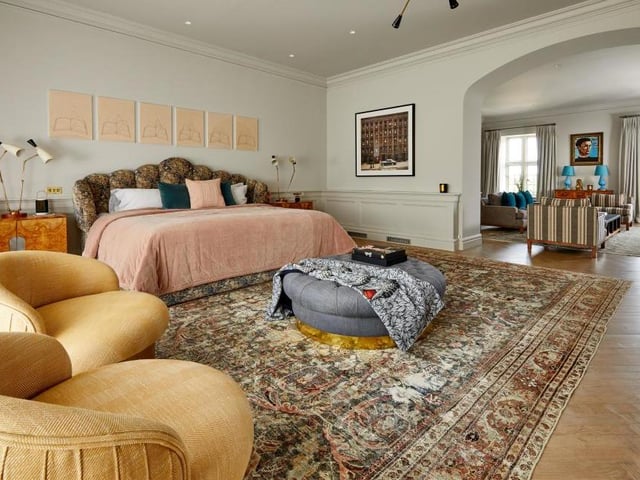 Robbie's number one hit features seven bedrooms, including this huge one. The remarkable property has been recently restored to an exemplary standard. It even has its own cottage and two flats for staff.