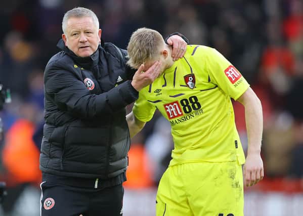 Chris Wilder, manager of Sheffield United, speaks to Aaron Ramsdale of AFC Bournemouth (Photo by Richard Heathcote/Getty Images)