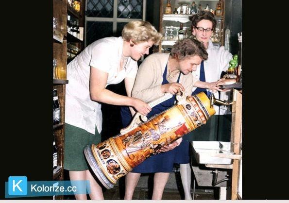 This beer stein helds 66 pints and is was said to be the largest in the world. It was at the Prince of Wales Hotel, Ecclesall Road, in February 1961 and the wife of the licensee, Mrs Cecil Clift (right) starts to fill it, helped by some of the bar staff. Picture: Sheffield Newspapers