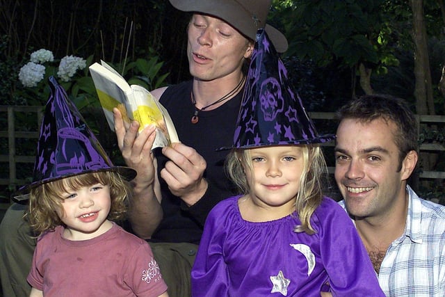 Ryan Morley read from the pre-publication copy of the new Harry Potter and the Order of the Phoenix book to his daughter Ella-Jay (3) and Gracie Hutton (5) who is sat on her dad Gary's knee back in 2003