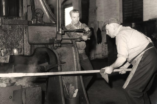 Jack Jowle, left, a tilter on a hammer, and hammer driver Albert Cockayne, right, at Arthur Balfour and Co Ltd - January 17 1958