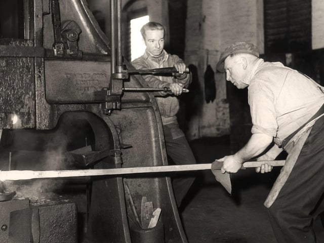 Jack Jowle, left, a tilter on a hammer, and hammer driver Albert Cockayne, right, at Arthur Balfour and Co Ltd - January 17 1958