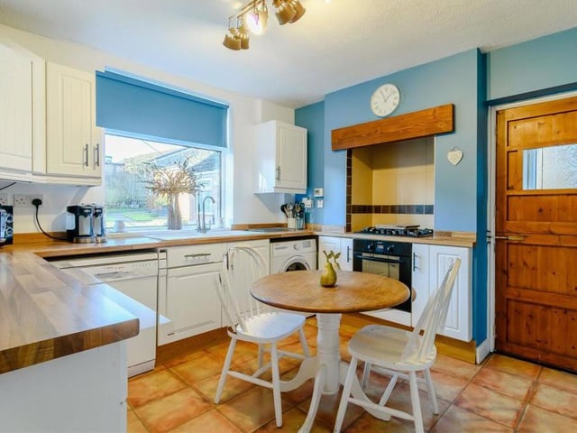 On entering the house, the side-entrance porch has a stable door (right), which leads you into this kitchen. It has all you need, including an integrated oven, five-ring gas hob with extractor hood above., an integrated fridge and freezer, inset sink with drainer and mixer tap, wall cupboards, base units, drawers and laminate work surfaces. There is also plumbing for a dishwasher and washing machine.
