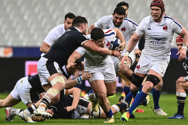 French hooker Julien Marchand being tackled by Rory Sutherland during the Six Nations rugby union tournament match between France and Scotland on March 26, 2021, at the Stade de France in Saint-Denis, outside Paris. (Photo by Anne-Christine Poujoulat/AFP via Getty Images)