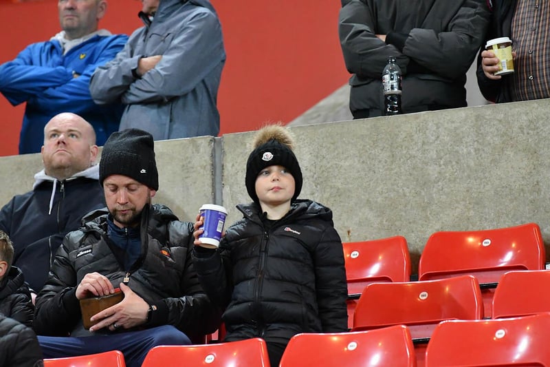 Young Sunderland fan drinks in the atmosphere. Picture by Frank Reid