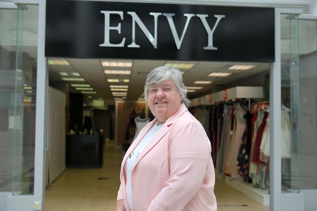 Carol Wilson, owner of Envy Gowns, which has reopened in Callendar Square.