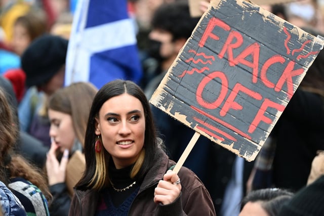 One protester at the march, who held a makeshift banner that reads 'Frack Off', was perhaps trying to follow in the path of Greta Thunberg - who said she would go 'net zero' on swearing earlier in the week.