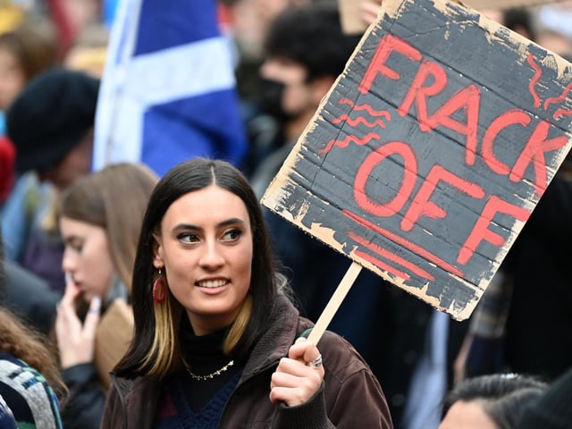 One protester at the march, who held a makeshift banner that reads 'Frack Off', was perhaps trying to follow in the path of Greta Thunberg - who said she would go 'net zero' on swearing earlier in the week.