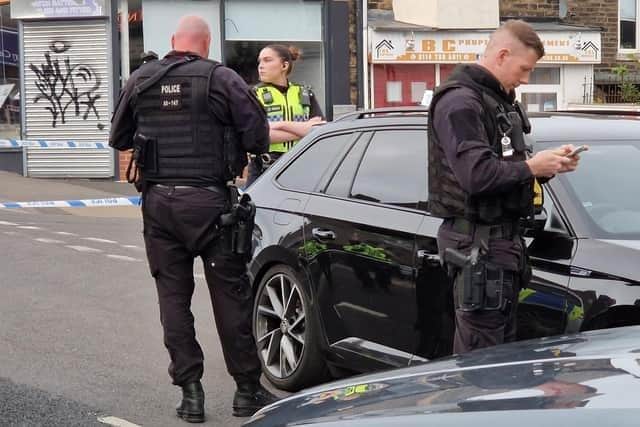 Police, including several armed officers with pistols, arrived in about 10 marked an unmarked cars flooded Crookes after a fatal stabbing on Thursday, May 25, 2023