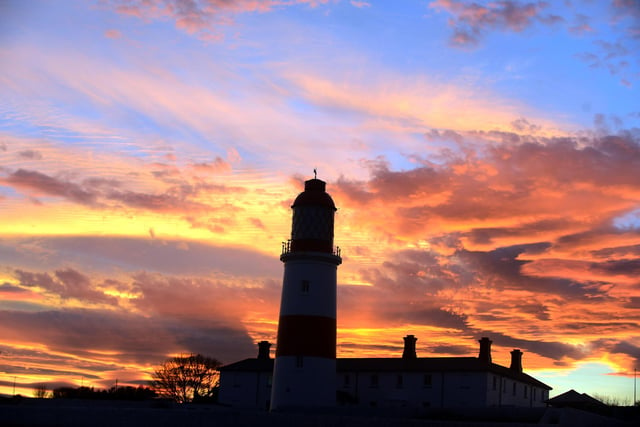 Souter Lighthouse standing tall with a magnificent sky behind it.