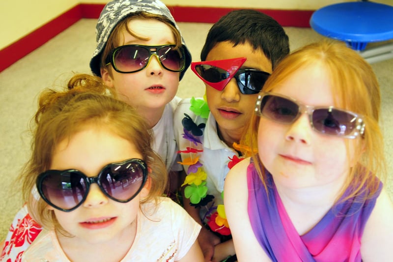 Key Stage 1 pupils (rear left to right) Finley Mulgrew and Jawaad Shah (front left to right) and Jennarose Francis and Holly Webb were dressed to represent the Summer season in this photo from 7 years ago.
