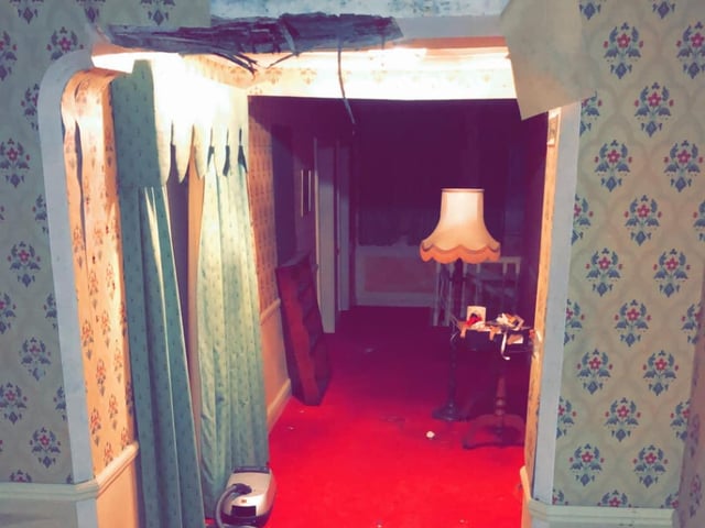 With its red carpets and winding coridoors, the abandoned mansion is straight out of a horror film.
