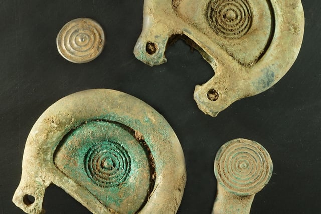 These decorative pieces come from a Bronze Age horse harness found near Peebles last month. The horse likely indicated power and status of the community it belonged to. PIC: Crown Office Communications/PA.