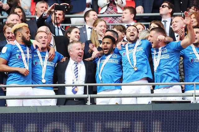 Kenny Jackett, centre left, celebrates Pompey's Checkatrade Trophy triumph with his players at Wembley. Picture: Joe Pepler