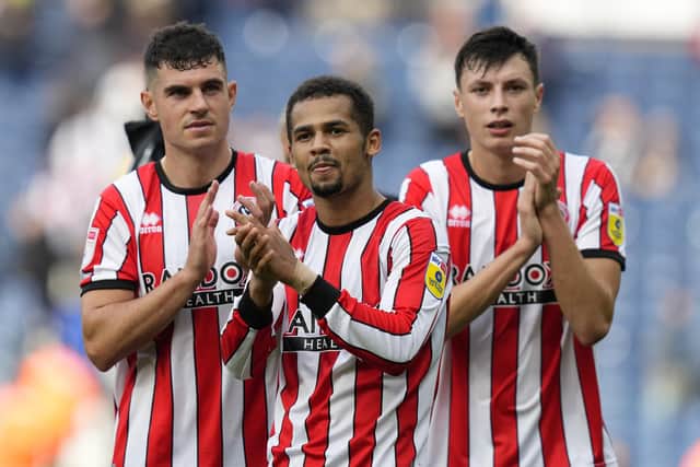 ohn Egan, lliman Ndiaye and Anel Ahmedhodzic of Sheffield United applaud the fans following the win over West Bromwich Albion: Andrew Yates / Sportimage
