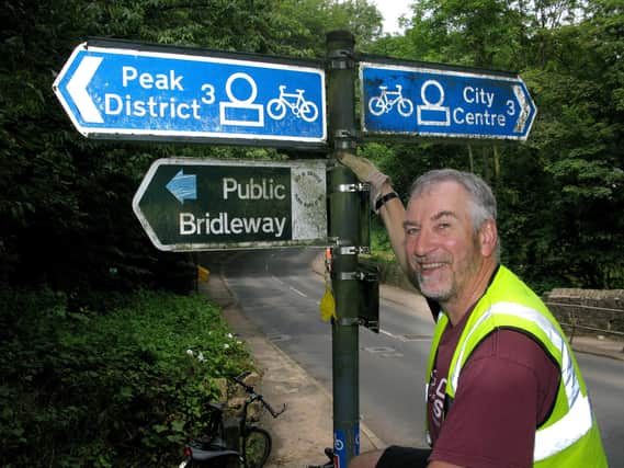 Simon Geller with Sustrans Route 6 signs in the Porter Valley