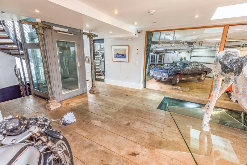 It has a double garage which also has an additional roller door to the rear courtyard enabling further storage for a dingy or water sports equipment. Picture: Fry and Kent