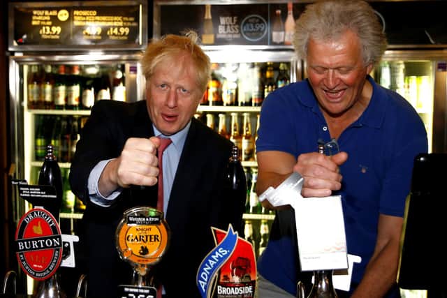 Wetherspoons founder Tim Martin (right) has been a vocal critic of Boris Johnson's (left) government and blames record losses on lockdown restrictions. Photo by: Henry Nicholls WPA Pool/Getty Images